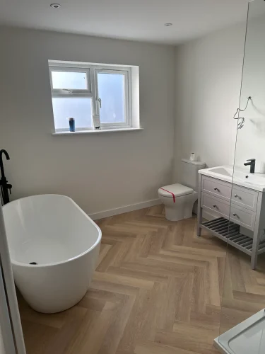 Finished bathroom with freestanding bath and walk-in shower in Eynesbury