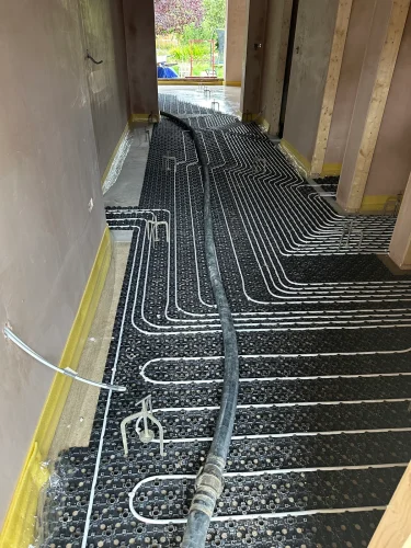 Underfloor heating pipework installed throughout the refurbished ground floor.