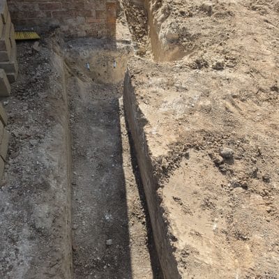 Concrete poured into the foundation trenches of an extension at Hinton Way, Great Shelford